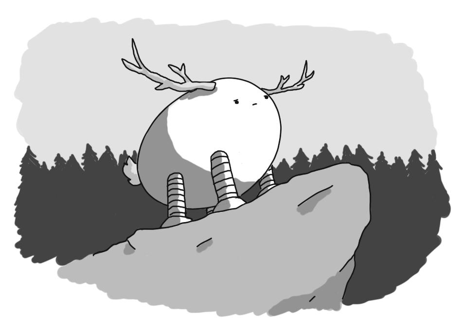 An ovoid, quadrupedal robot with banded legs, a tufty tail and wide, deer-like antlers. It's standing on a rocky promontory against a backdrop of dark pine forest, looking out sternly.