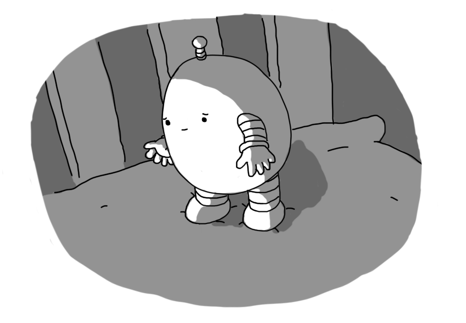 A little ovoid robot with chubby banded arms and legs, standing on a pillow with a sympathetic expression on its face.