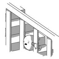 A round robot with banded arms and legs trapped between two uprights on a stair banister. It looks very distressed and is trying to pull itself free as it waggles its legs ineffectually.