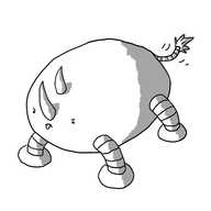 A horizontal ovoid robot with four banded legs. It has two curving horns set longitudinally on its face and a very angry expression as it bends down as if to charge. Naturally its tongue is sticking out and its waving a slim, banded tail with a tuft on the end.