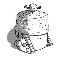 Teabot wearing a sort of semi-cylindrical woolen cap that covers its eyes. On top of the cap is a spherical bobble (also woolen) that is a robot with a happy face and two outstretched banded arms.