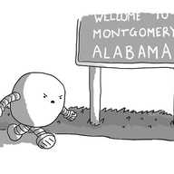 A roughly spherical robot with banded arms and legs, marching angrily past a sign reading "WELCOME TO MONTGOMERY ALABAMA"