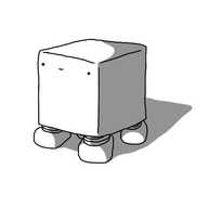 A cubical robot with four very short, banded legs on its underside. It has a faintly smiling face near the top of one of its sides.