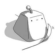 A trapezoid robot without limbs, sitting on the corner of a piece of paper whose edge is being blown slightly up from the surface it rests on. The robot has a banded antenna and is smiling happily.