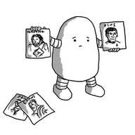 A potato-shaped robot holding up a picture of Thor labelled 'HEMSWORTH' in one hand and Captain Kirk labelled 'PINE' in the other. On the floor are two more pictures, one showing Captain America and labelled 'EVANS' and the other, partially obscured, but showing someone in a shirt and tie and part of the word 'PRATT'.
