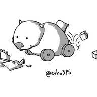 A robot that looks like a wombat with wheels instead of legs. It's eating some bits of scrap metal while a hatch at its rear drops little cubes on the floor.