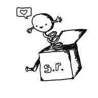 a jack-in-the-box toy with "s.r." written on the front. it's open and the spring is extended, but on the end is a happy, spherical robot with its arms held out. it has a speech bubble with a heart in it.